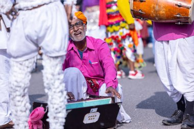 Bikaner, Rajasthan, India - January 2023: Camel Festival, Portrait of an rajasthani male with moustache, colorful turban wearing traditional colorful rajasthani dress. Rajput male of bikaner.