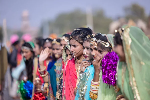 stock image Bikaner, Rajasthan, India - January 2023: Camel Festival Bikaner, Group of young beautiful girls in traditional dress and jewellery of rajasthan while participating in the parade. Selective focus.