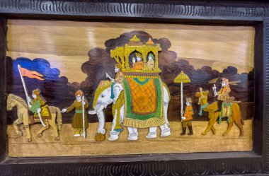 Yeni Delhi, Hindistan - Kasım 2022: Çerçeveli ahşap tuval üzerinde el yapımı tablo. Nesneye seçici odaklanma.