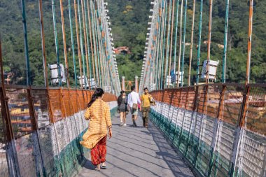 Rishikesh, Uttarakhand, India - October 2022: Holy Rishikesh, Portrait of unidentified brahmin male near river ganges ghat in rishikesh during winter morning. clipart