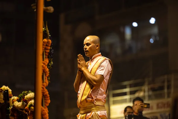 stock image Varanasi, Uttar Pradesh, India - November 2022: Ganga aarti, Portrait of an young priest performing river ganges evening aarti at Dashashwamedh Ghat in traditional dress with sanatan hindu rituals.