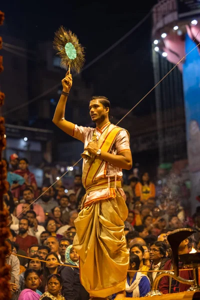 stock image Varanasi, Uttar Pradesh, India - November 2022: Ganga aarti, Portrait of an young priest performing river ganges evening aarti at Dashashwamedh Ghat in traditional dress with sanatan hindu rituals.