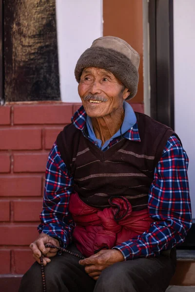 stock image Sarnath, Uttar Pradesh, India - November 2022: Portrait of an old man from tibbet with smiling face.