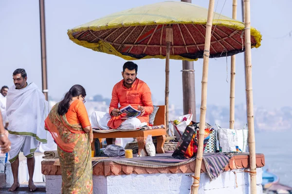 stock image Varanasi, Uttar Pradesh, India - November 20 2022: Portrait of Unidentified Indian holy brahmin male priest sittings on kedar ghat near river ganges in varanasi city in traditional dress