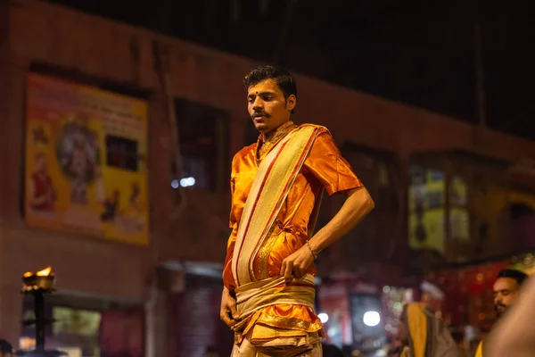 stock image Varanasi, Uttar Pradesh, India - November 20 2022: Ganga aarti, Portrait of young priest performing holy river ganges evening aarti at dashashwamedh ghat in traditional dress with hindu rituals.