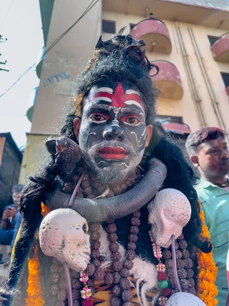 stock image Varanasi, Uttar Pradesh, India - March 03 2023: Masan Holi, Portrait of an male artist with painted face act as lord shiva during the celebration of masaan holi at harishchandra ghat in varanasi.