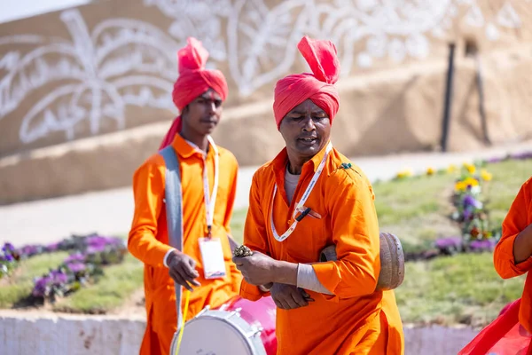 stock image Faridabad, Haryana, India - 4 February 2023: Portrait of male snake charmer performing during surajkund craft fair in ethnic dress to attract tourists.