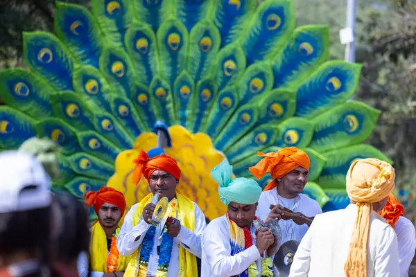 stock image Faridabad, Haryana, India - 4 February 2023: Portrait of male artists of haryana playing musical instruments during surajkund craft fair to entertain tourists.