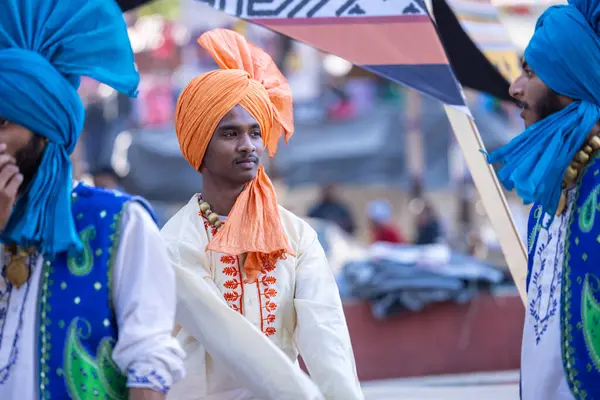 stock image Faridabad, Haryana, India - February 04 2023: Portrait of a male sikh in traditional punjabi clothes and turban during a bhangra dance performance at surajkund craft fair.