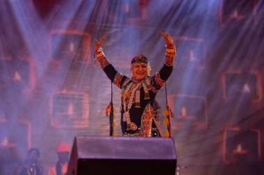 Pushkar, Rajasthan, India - November 05, 2022: Portrait of famous rajasthani folk artist gulabo sapera performing tribal folk dance Kalbelia at pushkar fair in traditional dress and jewellery clipart