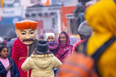 Ghaziabad, Uttar Pradesh, India - January 28 2024: Portrait of hindu devotees participating in rath yatra of lord jagannath and chanting krishna. clipart