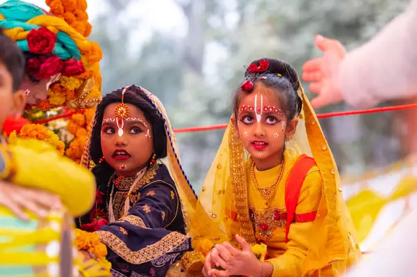 stock image Ghaziabad, Uttar Pradesh, India - January 28 2024: Portrait of beautiful young kids dresses as hindu gods during the rath yatra organised by iskon group for lord jagannath.