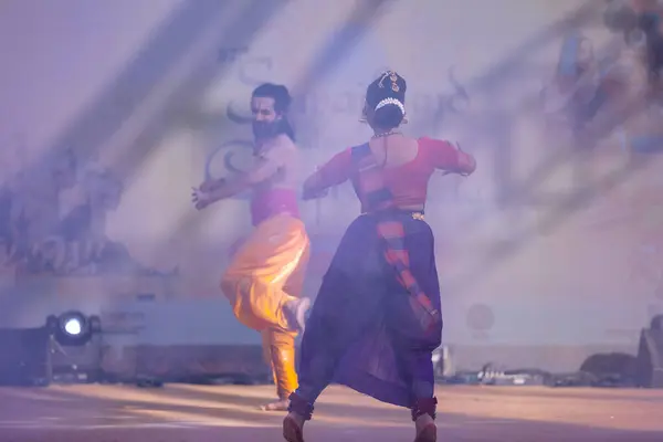 stock image Faridabad, Haryana, India - February 17 2024: Portrait of male and female south indian artist performing classical dance kuchipudi on stage at surajkund craft fair.