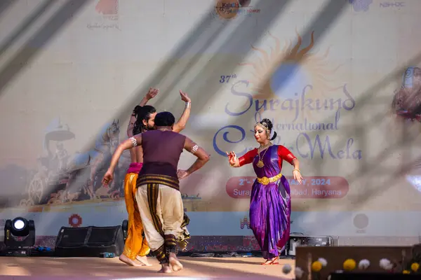 stock image Faridabad, Haryana, India - February 17 2024: Portrait of male and female south indian artist performing classical dance kuchipudi on stage at surajkund craft fair.