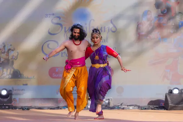 stock image Faridabad, Haryana, India - February 17 2024: Portrait of male and female south indian artist performing classical dance kuchipudi on stage at surajkund craft fair.