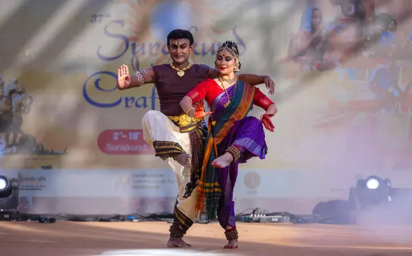 Stock image Faridabad, Haryana, India - February 17 2024: Portrait of male and female south indian artist performing classical dance kuchipudi on stage at surajkund craft fair.