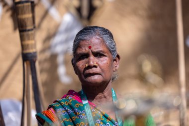 Faridabad, Haryana, India - February 17 2024: Portrait of foreigner female delegate participating in surajkund crafts fair to sell their country handmade craft products.