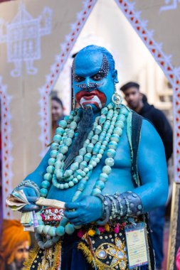 Faridabad, Haryana, India - February 17 2024: Portrait of an young male artist with painted face to play the character of jinn of aladdin series to entertain tourists.