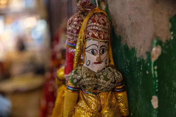 stock image Interior decorations, Handmade colorful hanging puppets for decoration on display at shop. Selective focus.