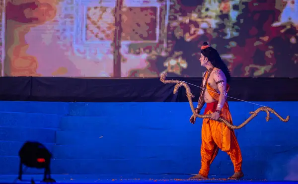 stock image Ghaziabad, Uttar Pradesh, India - October 23, 2023: Portrait of a male artist playing character of hindu god bharata with his arrow bow character of ramayana in ramlila during the dussehra festival.