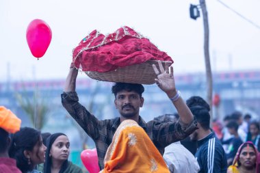 Chhath Puja, Chhath puja in traditional ethnic clothes near river bank clipart