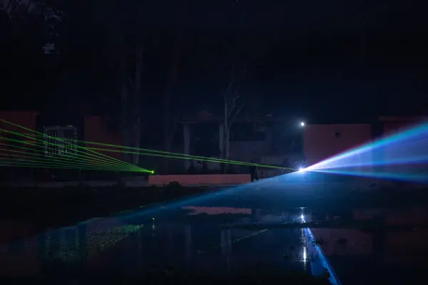 stock image Ghaziabad, Uttar Pradesh, India - November 19, 2023: Laser light show in the evening near Hindon river during Chhath Puja celebration.