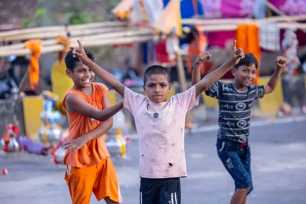 stock image Ghaziabad, Uttar Pradesh, India - Aug 01st, 2024: Portrait of Hindu pilgrims performing Kanwar yatra barefoot during Sawan shivratri and carrying holy ganga water to worship Hindu god shiv with rituals.