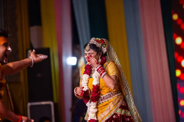 stock image Ghaziabad, Uttar Pradesh, India - March 17th, 2024: Portrait of a young artists playing phoolo ki holi as lord Krishna friend on stage during Holi festival in colorful ethnic clothes.