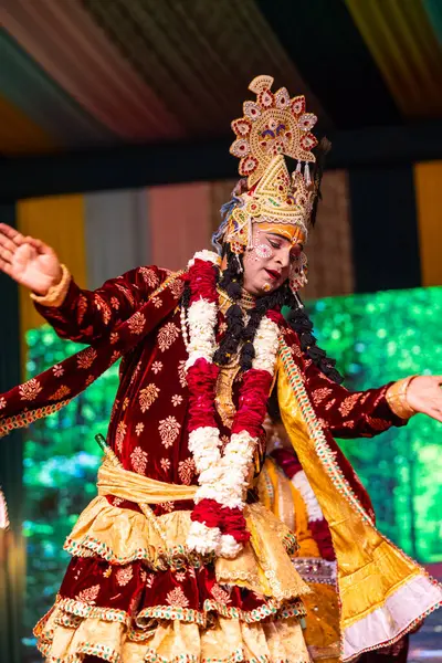 stock image Ghaziabad, Uttar Pradesh, India - March 17th, 2024: Portrait of a young artists playing phoolo ki holi as lord Krishna friend on stage during Holi festival in colorful ethnic clothes.