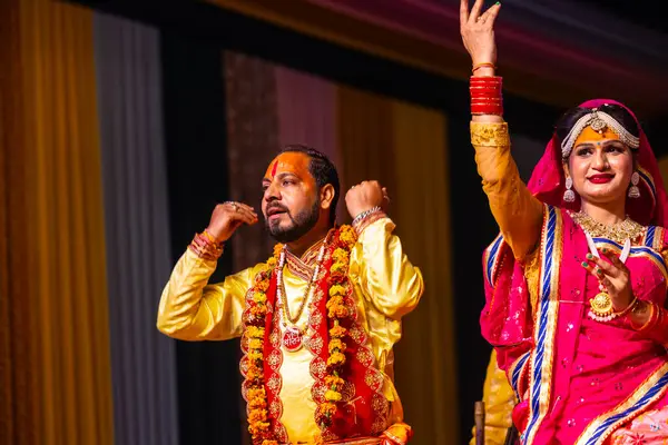 stock image Ghaziabad, Uttar Pradesh, India - March 17th, 2024: Portrait of a young artists playing phoolo ki holi as lord Krishna friend on stage during Holi festival in colorful ethnic clothes.