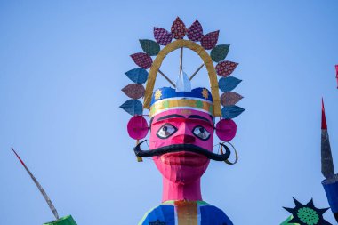 Handmade effigy of Indian Mythological King Ravana waiting to be burnt during Dussehra. A festival celebrated all over India on the occasion of Vijayadashami. clipart