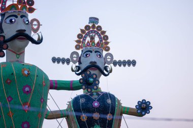 Handmade effigy of Indian Mythological King Ravana waiting to be burnt during Dussehra. A festival celebrated all over India on the occasion of Vijayadashami. clipart