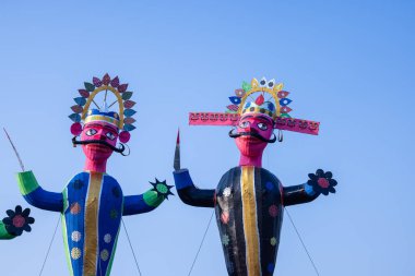 Handmade effigy of Indian Mythological King Ravana waiting to be burnt during Dussehra. A festival celebrated all over India on the occasion of Vijayadashami. clipart