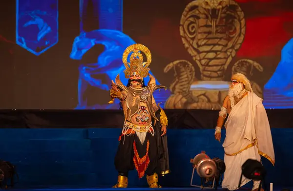 stock image Ghaziabad, Uttar Pradesh, India - October 24 2023: Portrait of a male artist playing character devil king Ravana with other character of an old man of Ramayana in Ramlila during the Dussehra festival. 