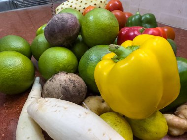 Fresh Sweet lemons, tomatoes and colorful bell peppers with plain background. clipart