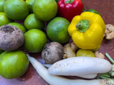 Fresh Sweet lemons, tomatoes and colorful bell peppers with plain background. clipart