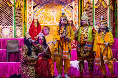 Ghaziabad, Uttar Pradesh, India - October 20, 2023: Portrait of the Indian artists playing characters of Hindu holy book Ramayana in Ramlila during the Dussehra festival. clipart