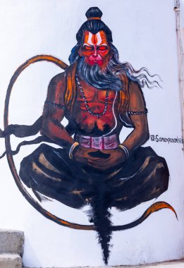 Varanasi, Uttar Pradesh, Hindistan - 19 Ocak 2024: Hindu tanrısı Hanuman ji 'nin el yapımı tablosu tapınağın yanında beyaz arkaplan.