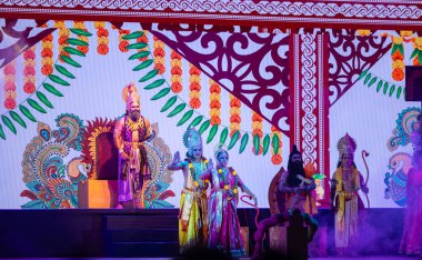 Ghaziabad, Uttar Pradesh, India: Artists playing during the dussehra festival. clipart