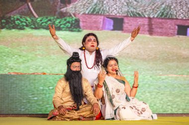 Ghaziabad, Uttar Pradesh, India: Artists playing during the dussehra festival. clipart