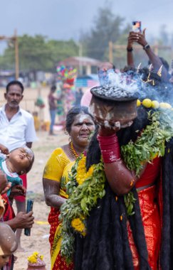 Kulashekharapatnam, Tamilnadu, India - October 11 2024: Kulasai, Portrait of indian hindu devotee with painted face and dressed as goddess kali to perform the rituals of kulasai dasara cult festival. clipart