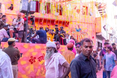 people from Nandgoan visits Barsana to play colorful Holi with the Women of Barsana as ritual of Lathmar holi every year clipart