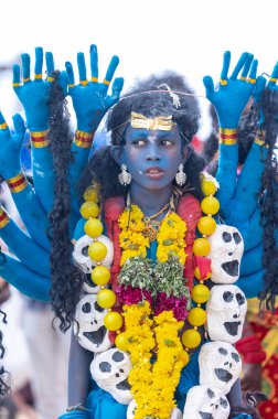 Kulashekharapatnam, Tamilnadu, India - October 11, 2024: Kulasai, Portrait of indian hindu devotee with painted face and dressed as goddess kali to perform the rituals of kulasai dasara cult festival. clipart