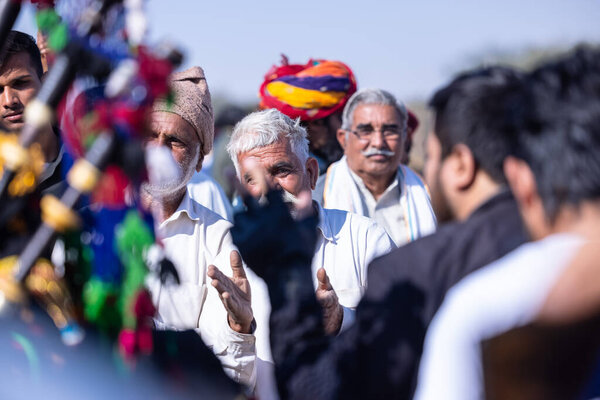 Bikaner, Rajasthan, India - January 15 2023: Portrait of a decorated camels at the desert ground at bikaner.