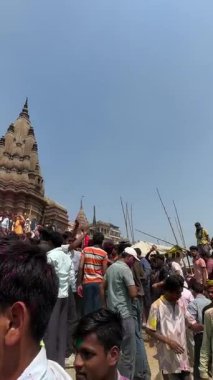 Barsana, Uttar Pradesh, India- March 18 2024: Group of people celebrating the festival of holi on the streets of barsana with herbal colours.