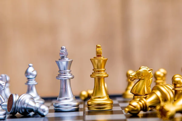 Business strategy competitive ideas concept, Chess game on chess board  behind business background. Business present financial and marketing  strategy analysis. Investment target in global economy . Stock Photo