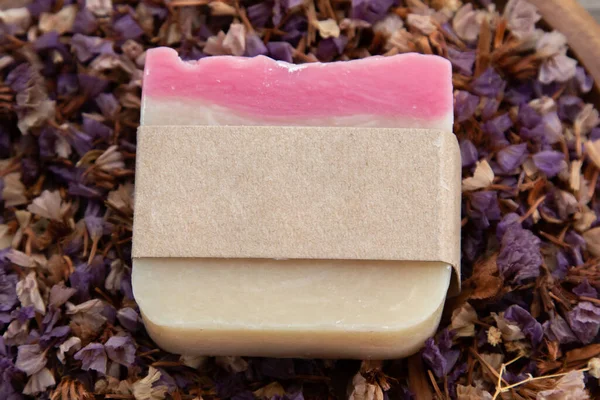 Mock up for small business homemade natural organic soap ,skin product mockup scene. Craft paper on cosmetic product ,natural aromatic spa treatment decoration on wooden vintage backgroun