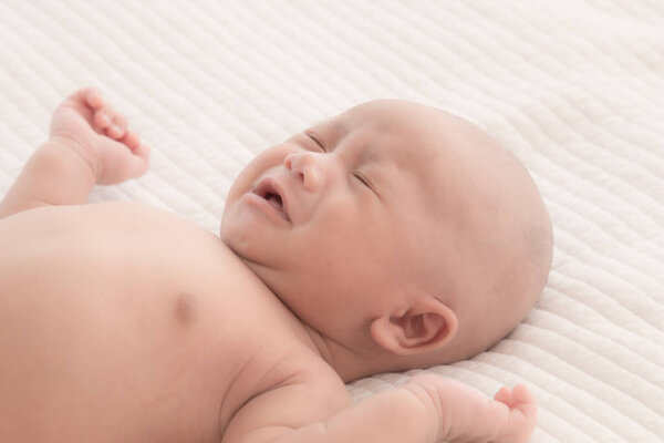 Newborn baby crying sick fever, get flu check up at clinic, Asian child infant 0-1month fussy screaming unhappy angry, hungry in bed at home, nursery young boy rough hard textile uncomfortable blanket