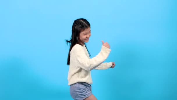 Asian happy school element girl lifestyle dancing with energetic and fun, smart kid spent time with music showing her step with cheerful, young kid lifestyle talent or extraordinary capability concept