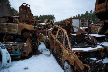 03.02.2023 Irpin, Ukraine: Stacked a bunch of crashed cars after fire and missiles attacks in city